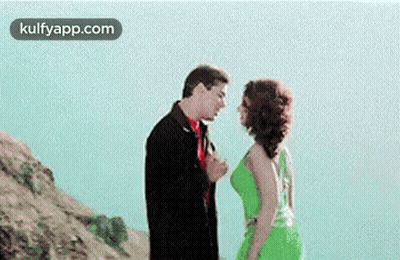 Man And Woman Kissing On A Hill GIF