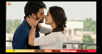 Man And Woman Kissing On Balcony GIF