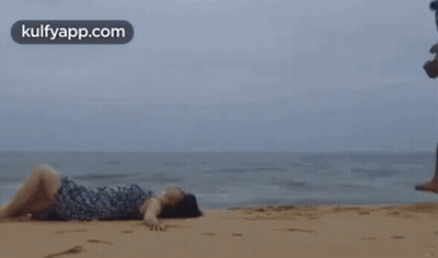 Man And Woman Kissing On Beach GIF