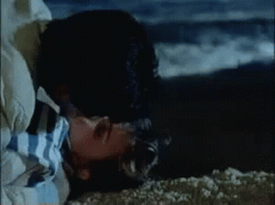 Man And Woman Kissing On Beach GIF