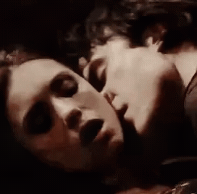 Man And Woman Kissing On Bed GIF