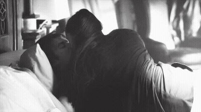 Man And Woman Kissing On Bed GIF