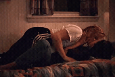 Man And Woman Kissing On Bed GIF