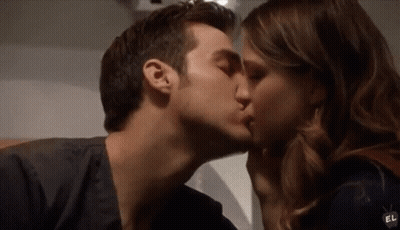 Man And Woman Kissing On Cheek GIF