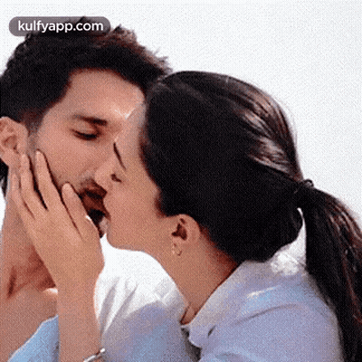 Man And Woman Kissing On Cheeks GIF