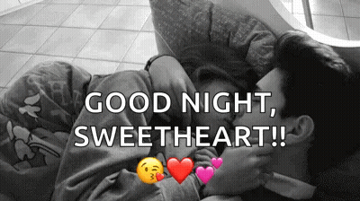 Man And Woman Kissing On Couch Saying Good Night Sweetheart GIF