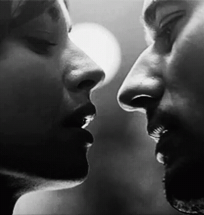 Man And Woman Kissing GIF
