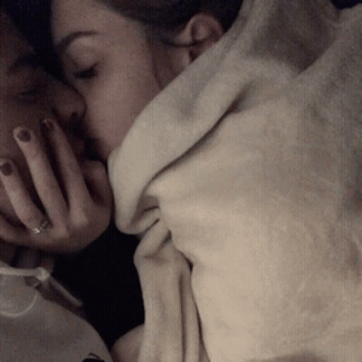 Man And Woman Kissing Under Blanket GIF