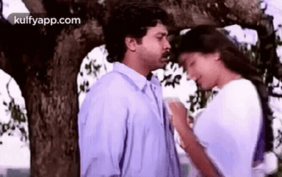 Man And Woman Kissing Under Tree GIF