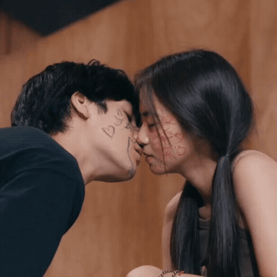 Man And Woman Kissing With Bee GIF
