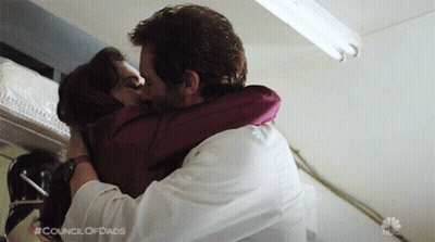 Man And Woman Kissing With Council Of Dads GIF