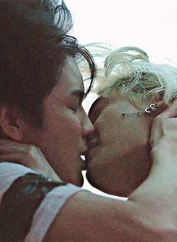 Man And Woman Kissing With Earrings GIF