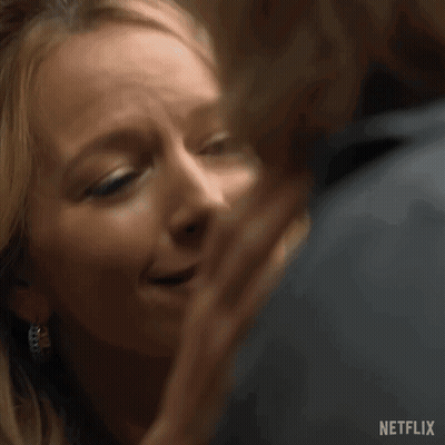 Man And Woman Kissing With Netflix Logo GIF