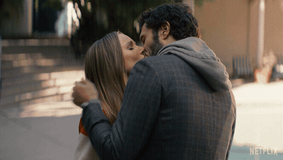 Man And Woman Kissing With Netflix Logo GIF