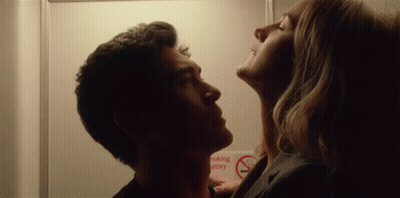 Man And Woman Kissing With No Smoking Sign GIF