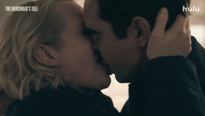 Man And Woman Kissing With The Handmaid's Tale GIF