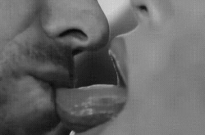 Man and Woman Kissing With Tongues Out