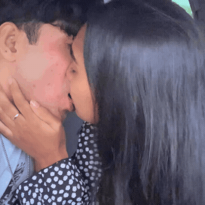 Man And Woman Kissing Woman In Polka Dot Dress GIF