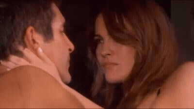 Man And Woman Kissing Woman Looking At His Face GIF