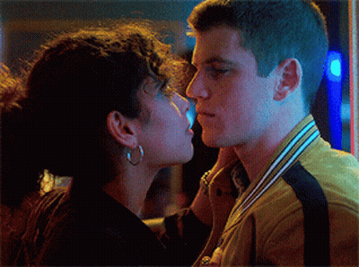 Man And Woman Kissing Woman Wearing Earrings GIF