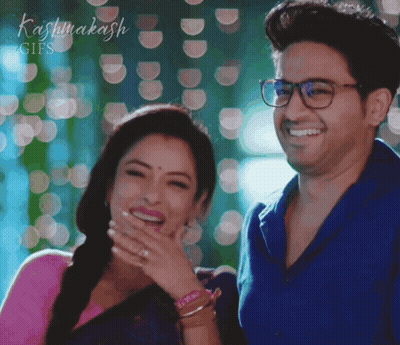 Man And Woman Laughing In Front Of Kashmakash Sign GIF
