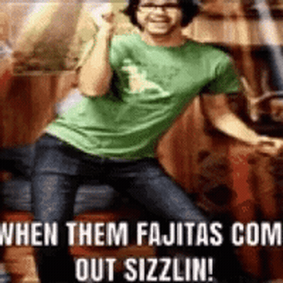 Man And Woman Laughing On Couch Saying My Fajitas GIF