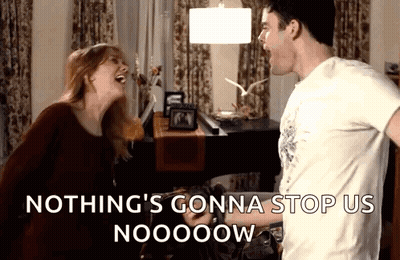 Man And Woman Laughing Saying Nothing's Gonna Stop Us Now GIF