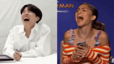 Man And Woman Laughing Woman Holding Cell Phone GIF