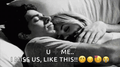 Man And Woman Laying In Bed Hugging GIF