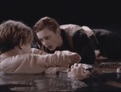 Man And Woman Laying In Water GIF