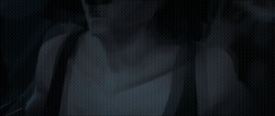 Man And Woman Laying On Bed In Dark GIF