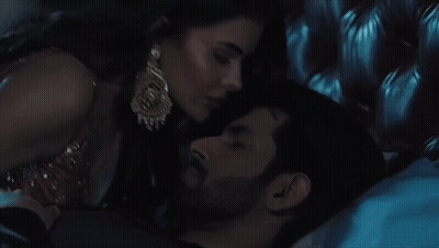 Man And Woman Laying On Bed GIF