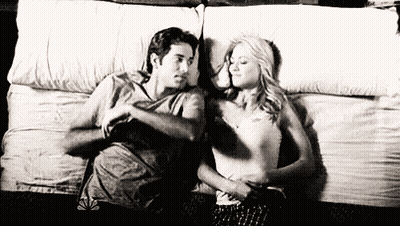 Man And Woman Laying On Bed GIF