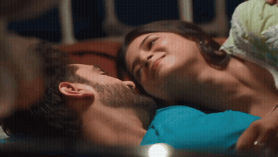 Man And Woman Laying On Bed Woman Smiling GIF