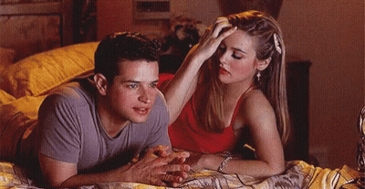 Man And Woman Laying On Bed Woman Touching Man's Head GIF
