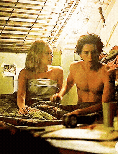 Man And Woman Laying On Bed Woman Wrapped In Blanket GIF