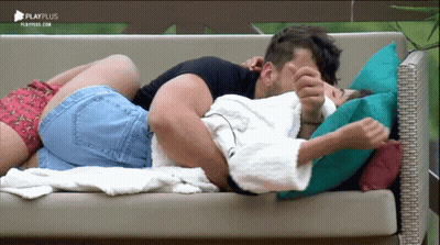 Man And Woman Laying On Couch With Playplus GIF