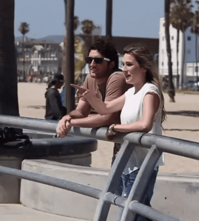 Man and Woman Leaning on Railing