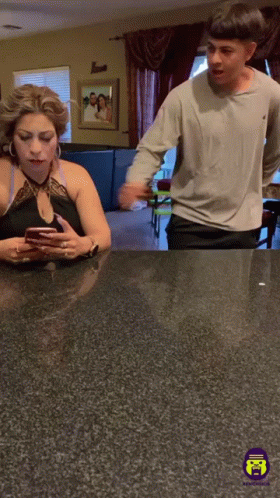 Man And Woman Looking At Cell Phone GIF