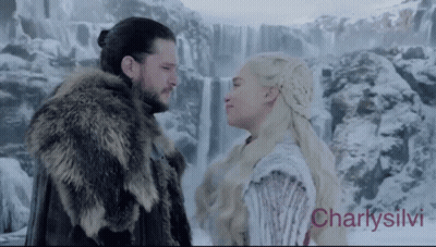 Man And Woman Looking At Each Other By Waterfall GIF