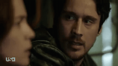 Man And Woman Looking At Each Other Close Up GIF