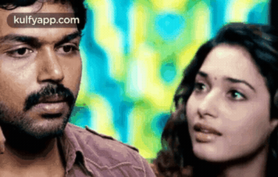Man And Woman Looking At Each Other Colorful Background GIF