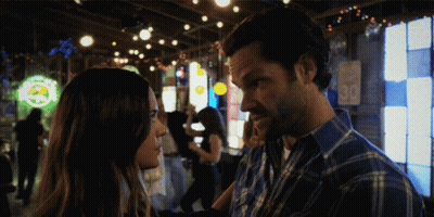 Man And Woman Looking At Each Other In Bar With 30 GIF