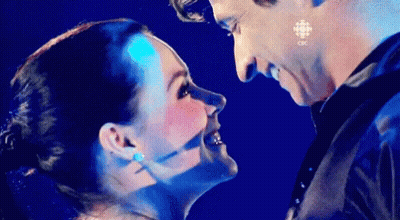 Man And Woman Looking At Each Other In Blue Light GIF
