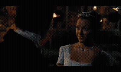 Man And Woman Looking At Each Other In Dark GIF