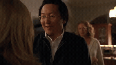 Man And Woman Looking At Each Other In Dark Room GIF