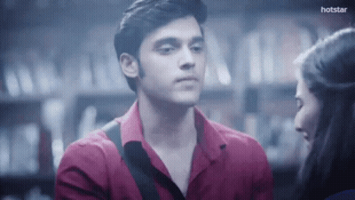 Man And Woman Looking At Each Other In Dark Room GIF