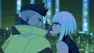 Man And Woman Looking At Each Other In Front Of City At Night GIF