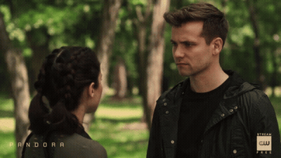 Man and Woman Looking at Each Other in Park Saying Pandora