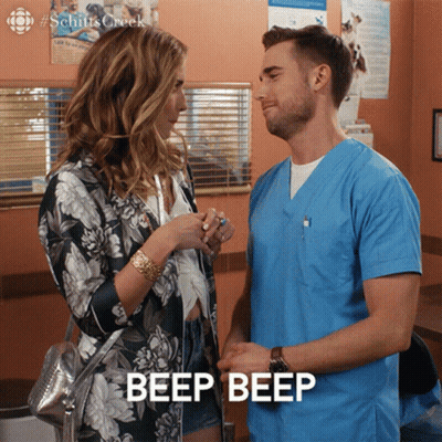 Man And Woman Looking At Each Other Saying Beep GIF